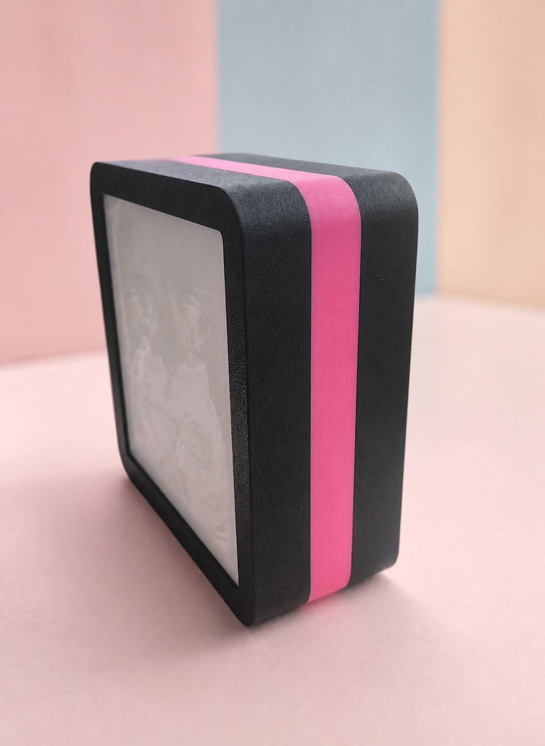 Glow Mini with a pink accent band around the middle layer